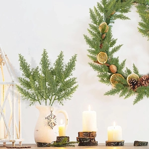 Artificial pine branches with dried orange slices and pine cones for Christmas decor