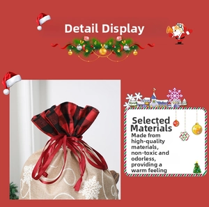 Detail of Christmas burlap gift bag with red plaid trim, snowflake print and satin drawstring