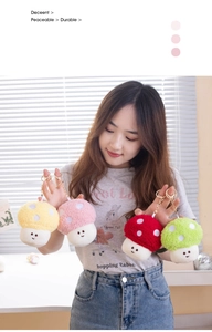 Detail of four colorful plush mushroom keychains with white dots and cute smiley faces