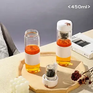 Magnetic tea separation glass bottle 450ml with white sleeve on a stone tray