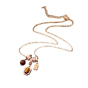 Rose gold tiger eye stone pendant necklace with crystal rings and metallic charms