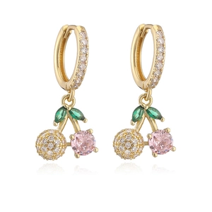 Macro detail of cherry charm hoop earrings with pink cubic zirconia and green leaf gems