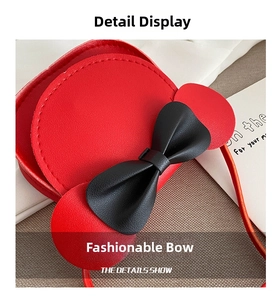 Detail view of red PU leather toddler bag with black 3D bow and cartoon round ears