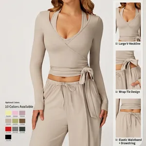 Deep V-neck yoga set with wrap-tie long sleeve top and drawstring wide-leg pants
