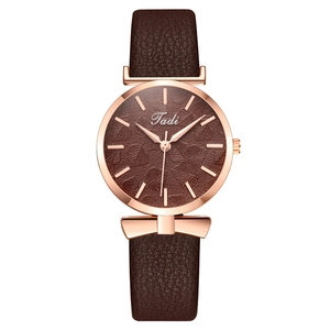 Elegant ladies quartz watch with brown leaf pattern dial and rose gold bow decoration