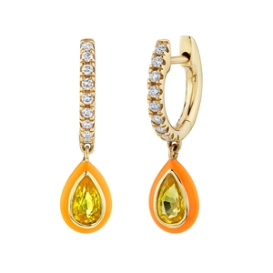 Detail view of gold hoop earrings with orange enamel and yellow teardrop crystal charms