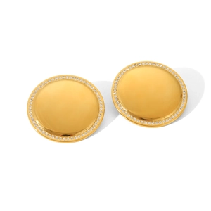 Macro detail of round 18K gold-plated stainless steel earrings with sparkling white zircons