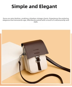 Detail view of a vintage mini crossbody bag in cream and dark brown with silver ring buckle