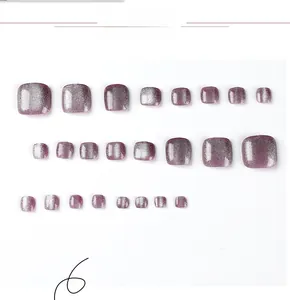 Detailed view of pink purple cat eye magnetic glitter press on toenails in various sizes