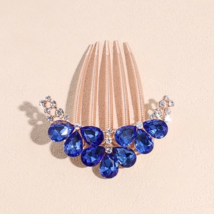 Detail of rose gold hair comb with dark blue teardrop rhinestones and clear crystals