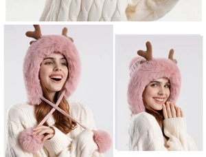 Detail of pink plush earflap hat featuring cute deer antlers and long pom-pom drawstrings