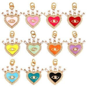 Detailed grid of 11 colorful heart pendants with crown and evil eye enamel charms