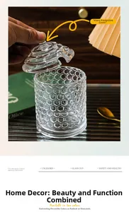 Close-up of hand lifting the lid of a honeycomb textured unleaded glass storage jar