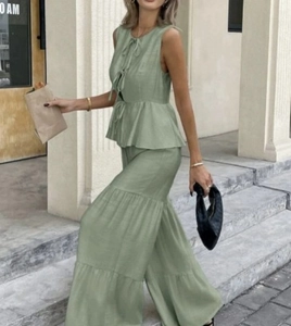 Grass green two-piece set featuring lace-up ruffle top and layered wide-leg pants