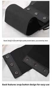 Detail of black elastic corset belt with three metal snaps and high stretch fabric texture