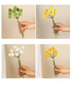 Close-up of artificial Craspedia flower bouquets in green, yellow, white, and orange