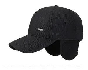 Detail of winter baseball cap with ear flaps and embossed SPORT logo in black