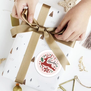50 pieces of cute Christmas reindeer stickers used on a white gift box with silk ribbon