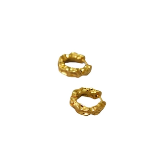 French minimalist gold lava textured hoop earrings with irregular hammered surface design