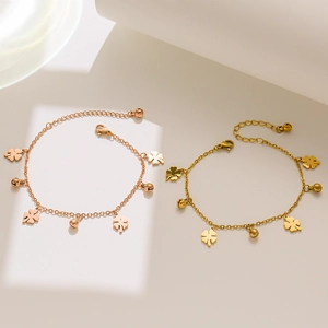 Elegant four-leaf clover charm bracelet in rose gold and gold finish with small metal bells