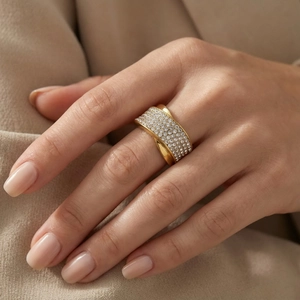 Detailed close-up of wide gold-plated titanium ring with double-row diamond pavé setting