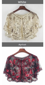 Detailed embroidery of gold and red sequins on mesh shawls for evening dresses