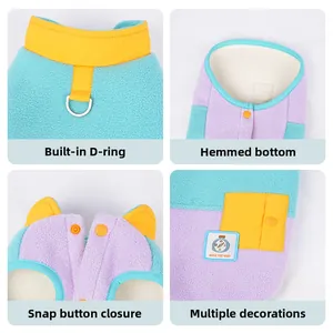 Detail of pet fleece vest showing D-ring harness connector and snap button closure