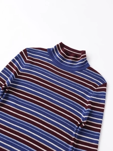 Macro detail of the high turtleneck and multicolor striped knit fabric texture