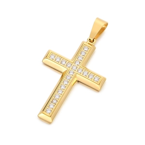 Golden stainless steel cross pendant necklace with clear crystals on white background