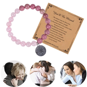Pink natural stone compass bracelet with a heartfelt 'You'll Be Missed' farewell gift card