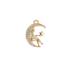 Vintage gold crescent moon and star pendant necklace with zircons on white background