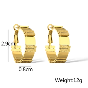 Detailed view of gold geometric hoop earrings showing 2.9cm height and 12g weight specs