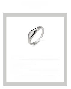 Detail of adjustable open ring with minimalist liquid metal design in dual-tone finish