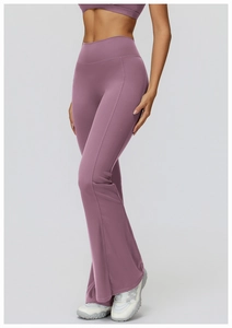 Detail shot of high waist flared yoga pants with slimming ruching in dusty purple fabric