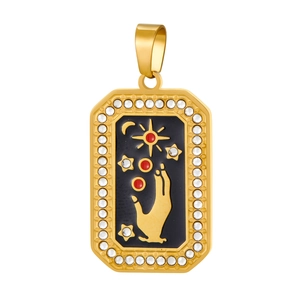 Detail of gold moon and sun pendant with black enamel and white zircon stones