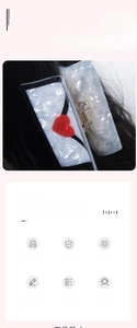 Rectangle marble acetate hair claw clip with red heart detail shown on long black hair