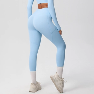 High-waisted light blue yoga leggings with side pockets and slim-fit lifting design