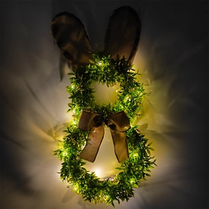 Couronne de lapin de Pâques lumineuse avec feuilles vertes et lumières LED blanc chaud