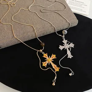 Vintage gold and silver cross necklaces with gemstones and stone beads on snake chains