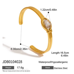 Detail of 18K gold stainless steel bangle with dimensions and oval white zircon inlay