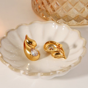 Elegant gold double teardrop stainless steel stud earrings with shimmering crystals