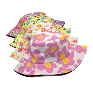 Reversible floral bucket hat with colorful summer patterns for outdoor sun protection