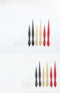 Detailed close-up of model 970 aluminum clock hands in black, gold, red, and white