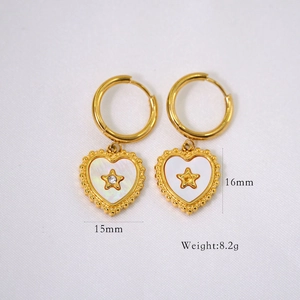 Detailed view of gold heart earrings with white shell inlay, size 15mm by 16mm, weight 8.2g