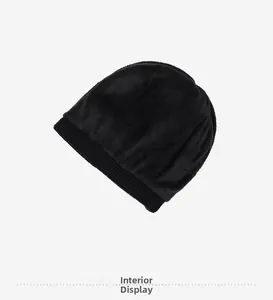 Detailed interior view of the winter knitted hat featuring thick black thermal fleece lining