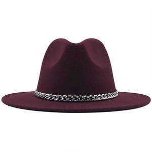 Front view of a maroon wide brim felt fedora hat with a decorative silver chain band