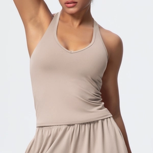 Detail of beige ribbed yoga set featuring v-neck sports bra and high-waisted shorts