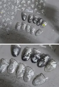 Detail of 5D embossed nail stickers featuring silver fairy silhouettes and magic motifs