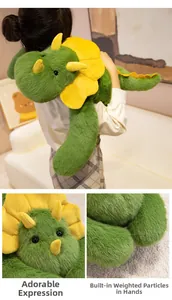 Detail of green triceratops plush with cute embroidery and weighted pellets in paws