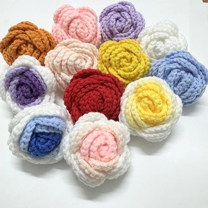 Handmade crochet rose bouquet in multiple colors including red pink and yellow on white